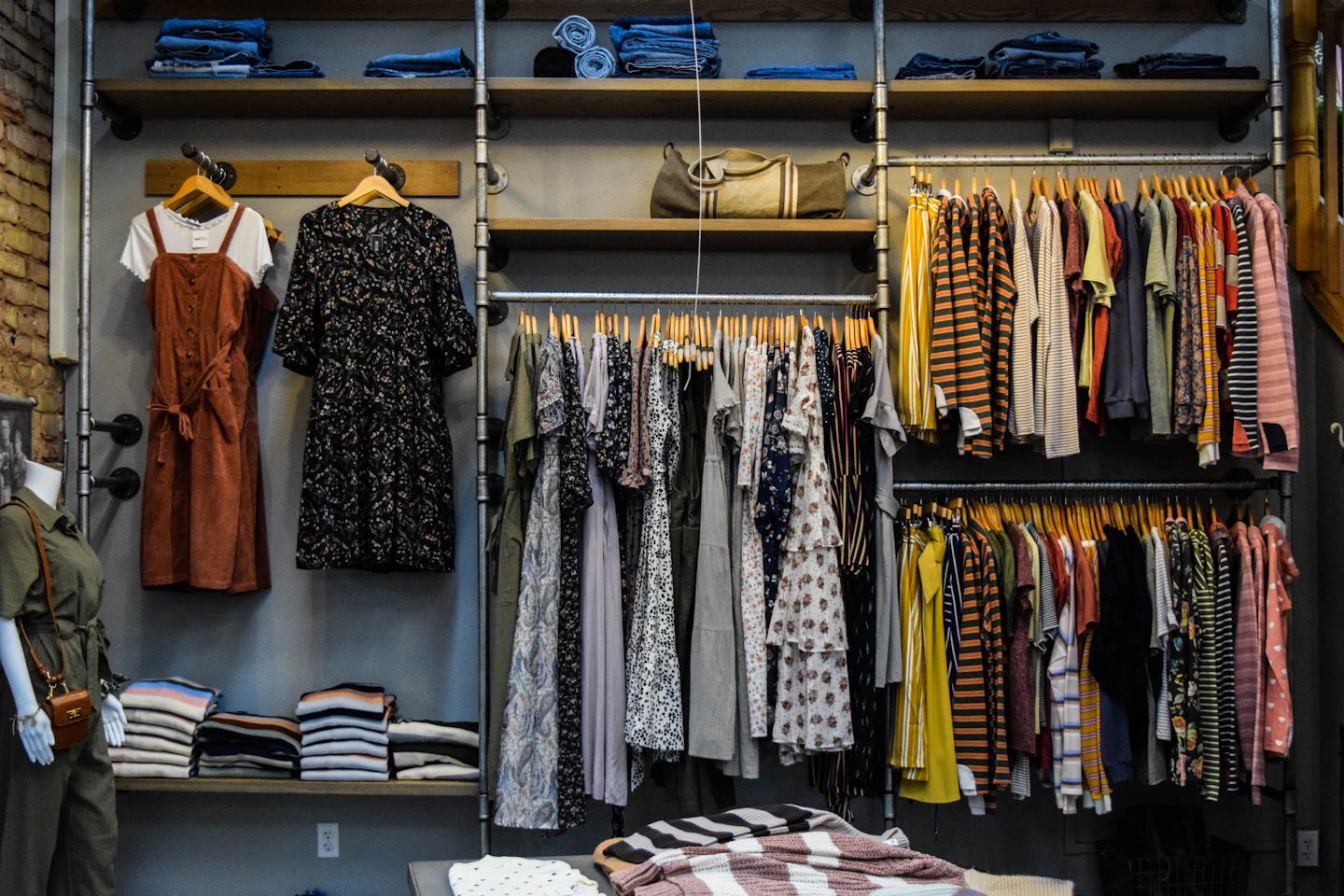 Clothing displays and stocked shelves inside a retail store.