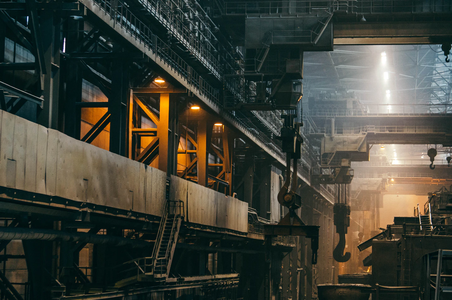 Overhead cranes and steel structures inside a large industrial factory