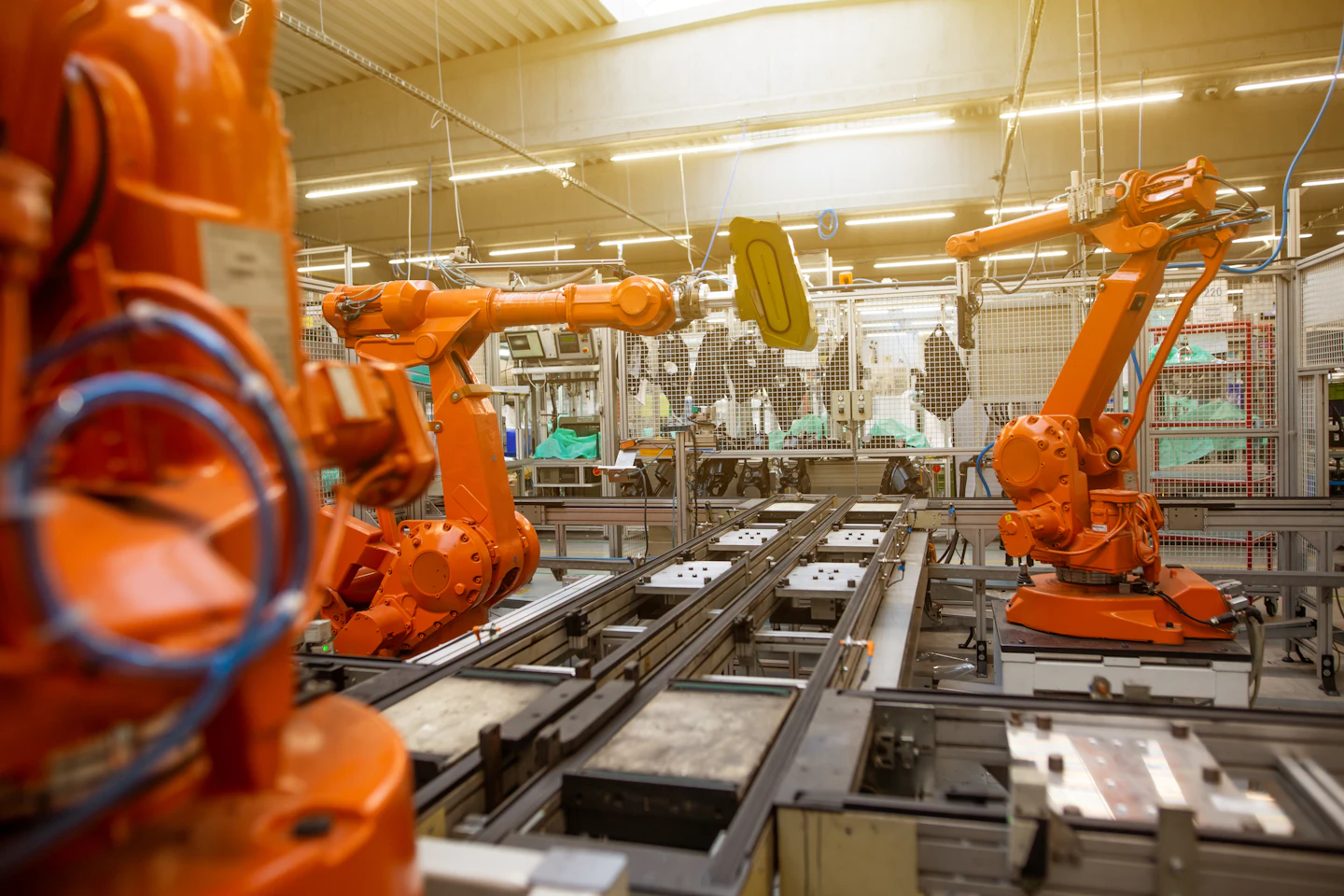 Industrial robotic arms on an automated manufacturing line